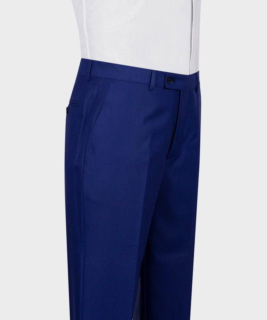 Blue dress pants worn with a white shirt on a light gray background