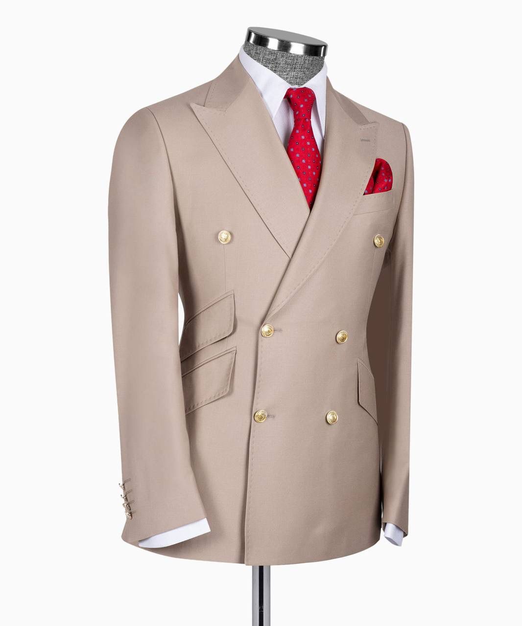 Beige suit jacket with gold buttons on a mannequin against a white background