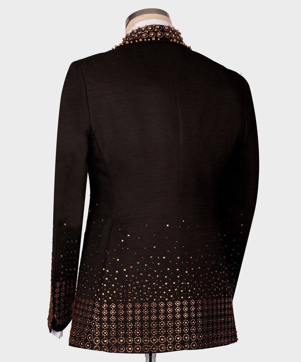 Black blazer with gold patterned hem on a mannequin 
