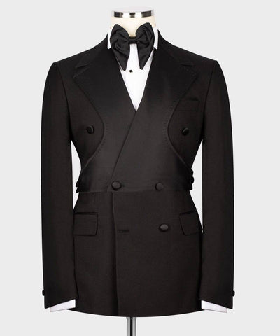 Black tuxedo jacket with bow tie on a mannequin against a white background