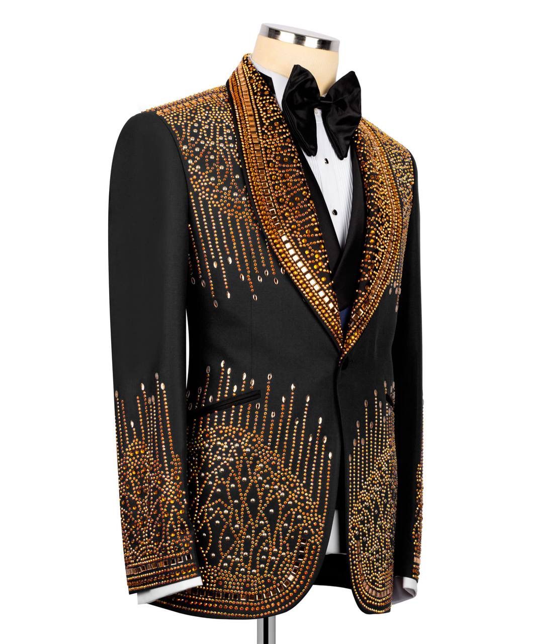 Black tuxedo with gold embellishments on the entire suit
