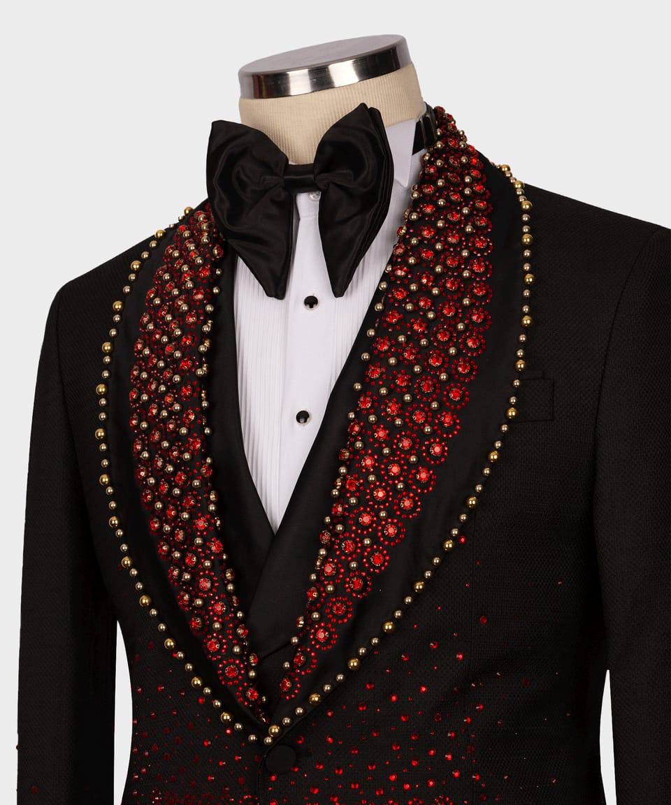 Black tuxedo with red and gold embellishments 