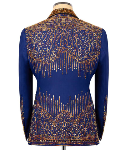 Blue jacket with gold bead embellishments on a mannequin against a white background