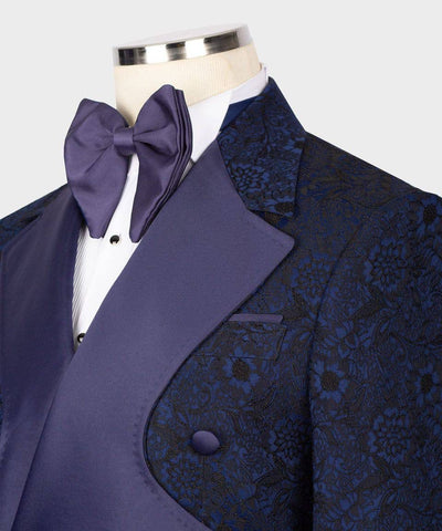 Blue patterned jacket with a purple bow tie on a mannequin against a white background