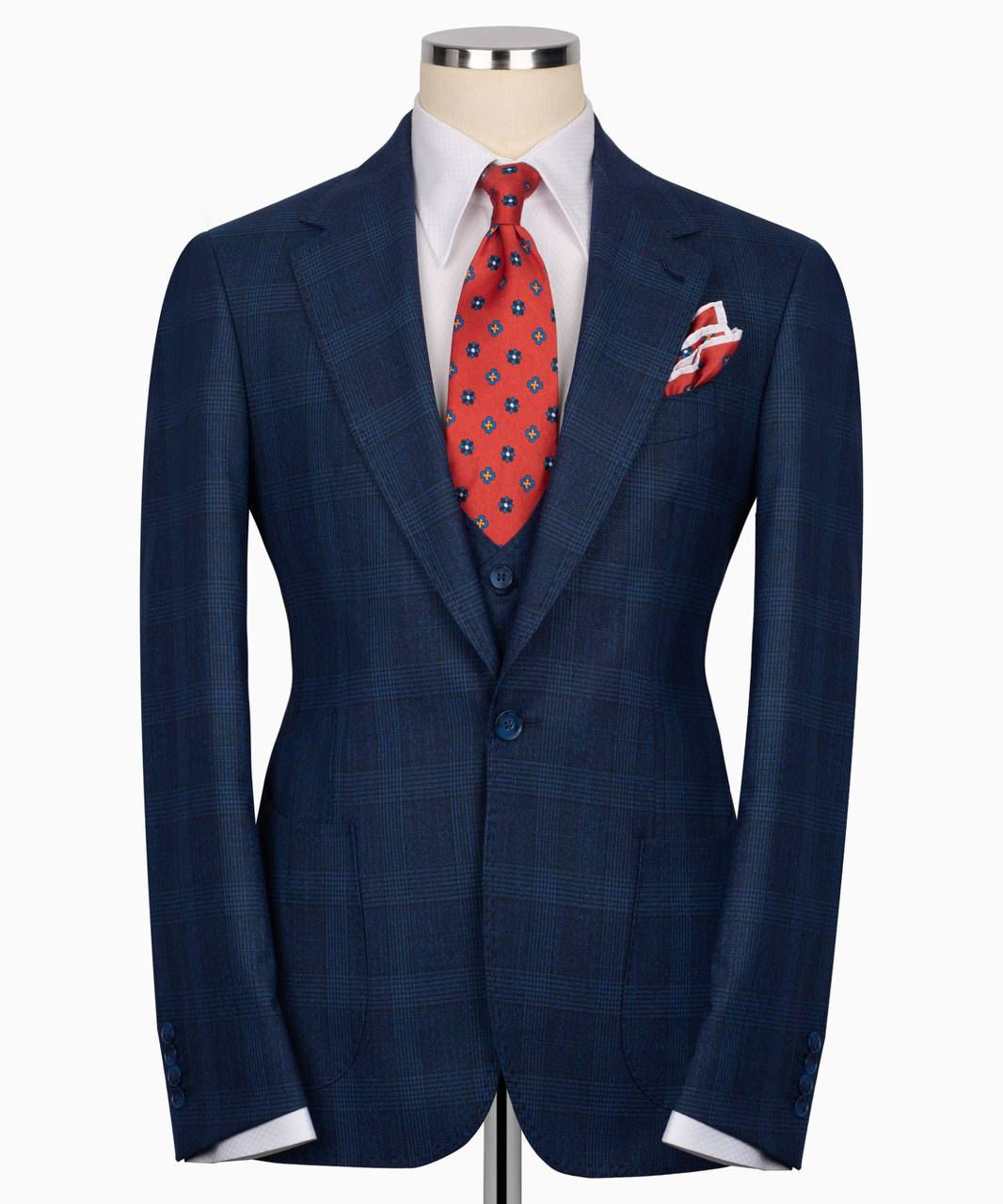 Blue suit jacket with a red tie and pocket square 