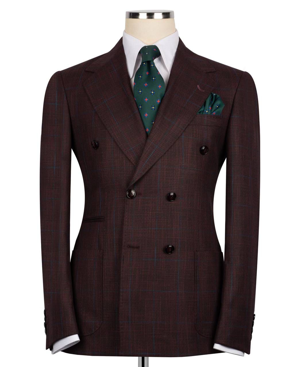 Brown suit jacket with a green patterned tie and pocket square 