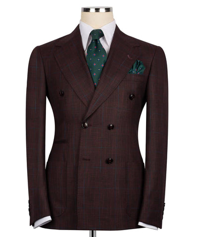 Brown suit jacket with a green patterned tie and pocket square 