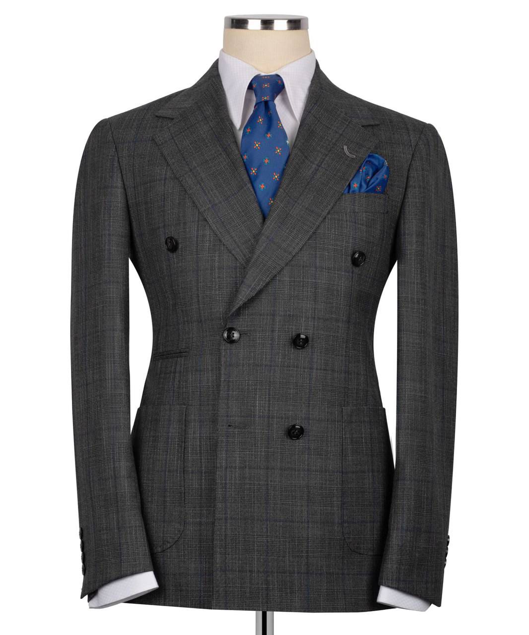 Gray double-breasted suit jacket with a blue tie and pocket square