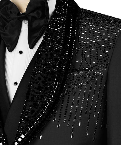 Black tuxedo with a bow tie and sequin detailing on the lapel.