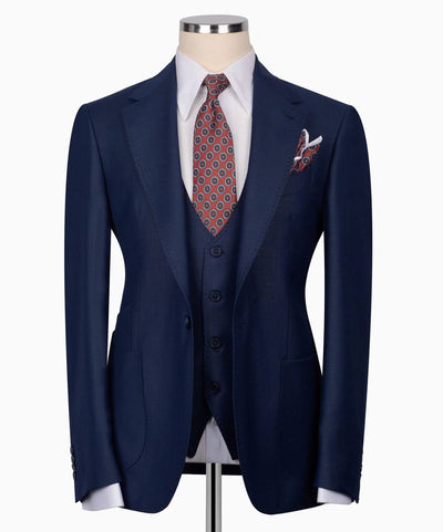 Navy blue suit with patterned tie and pocket square 