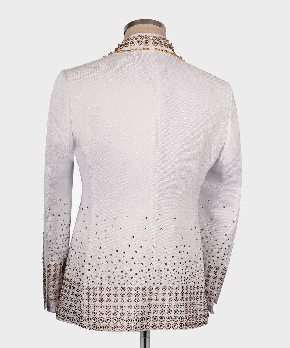 Reddish-greyblouse with gold embroidery on a mannequin against a white background