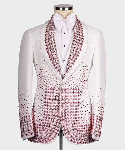White dinner jacket with red pattern on a mannequin against a white background