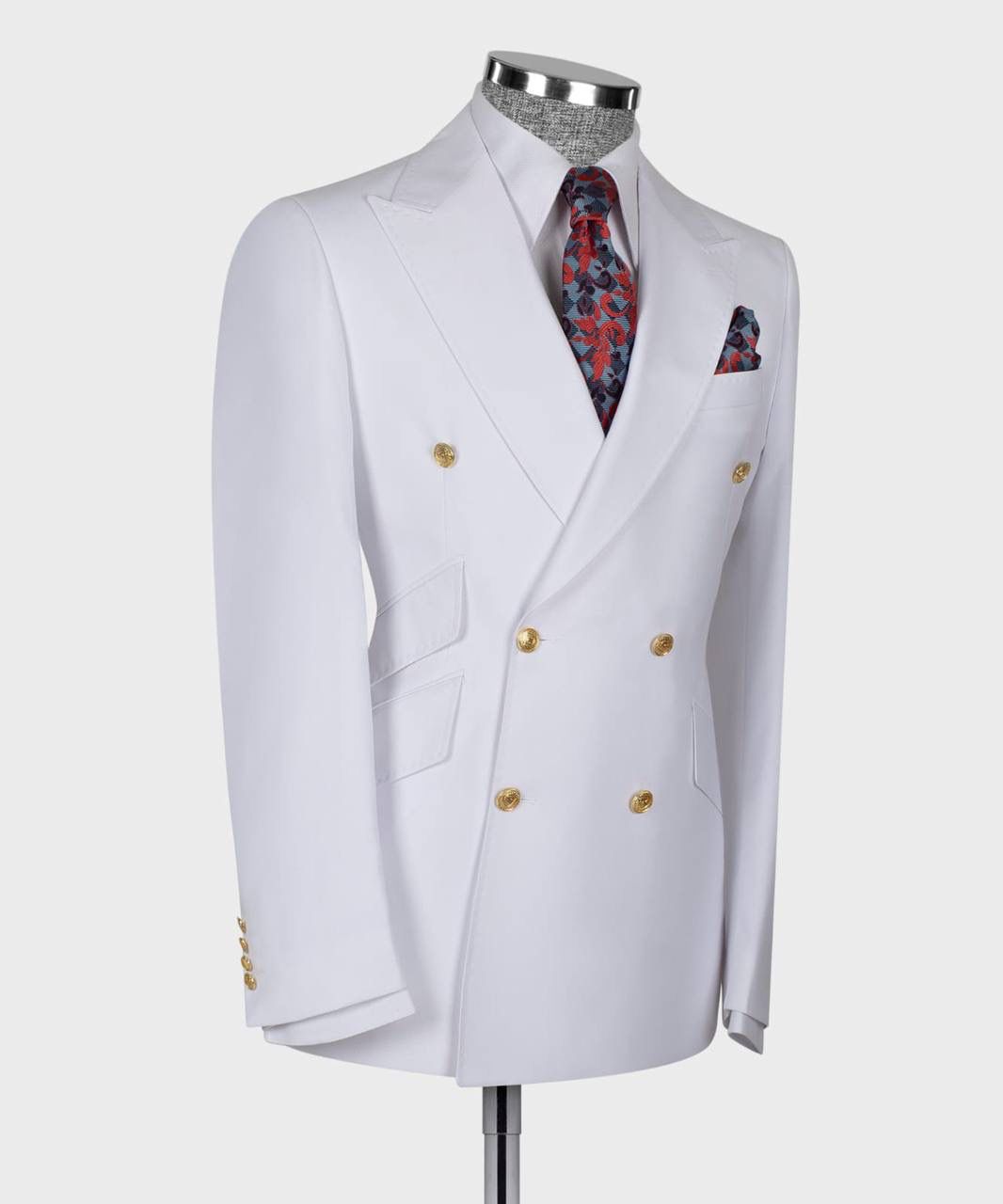 White double-breasted jacket with gold buttons on a mannequin against a white background