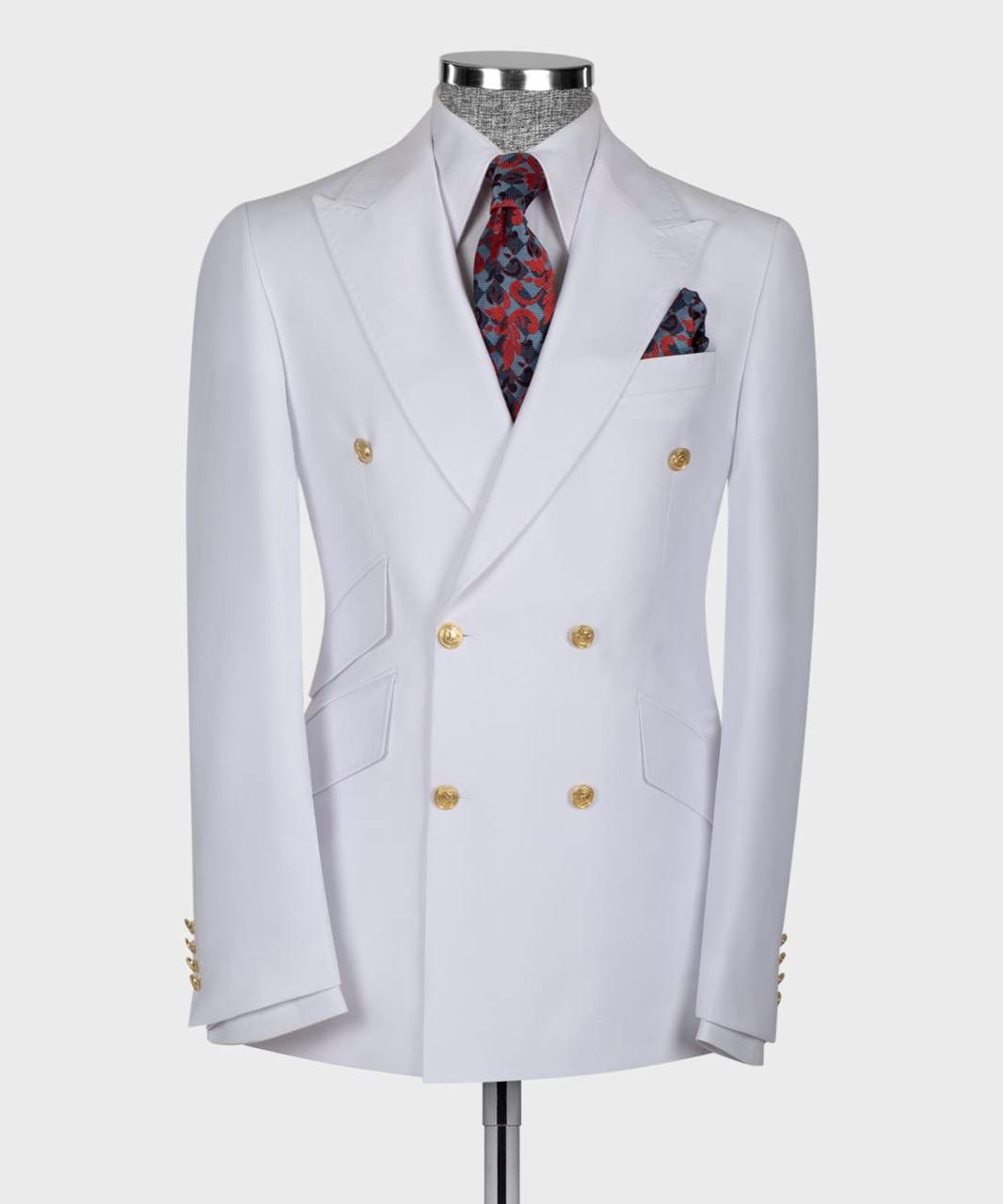 White double-breasted suit jacket with gold buttons on a mannequin against a white background