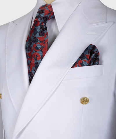 White suit jacket with a red and black patterned tie and pocket square.