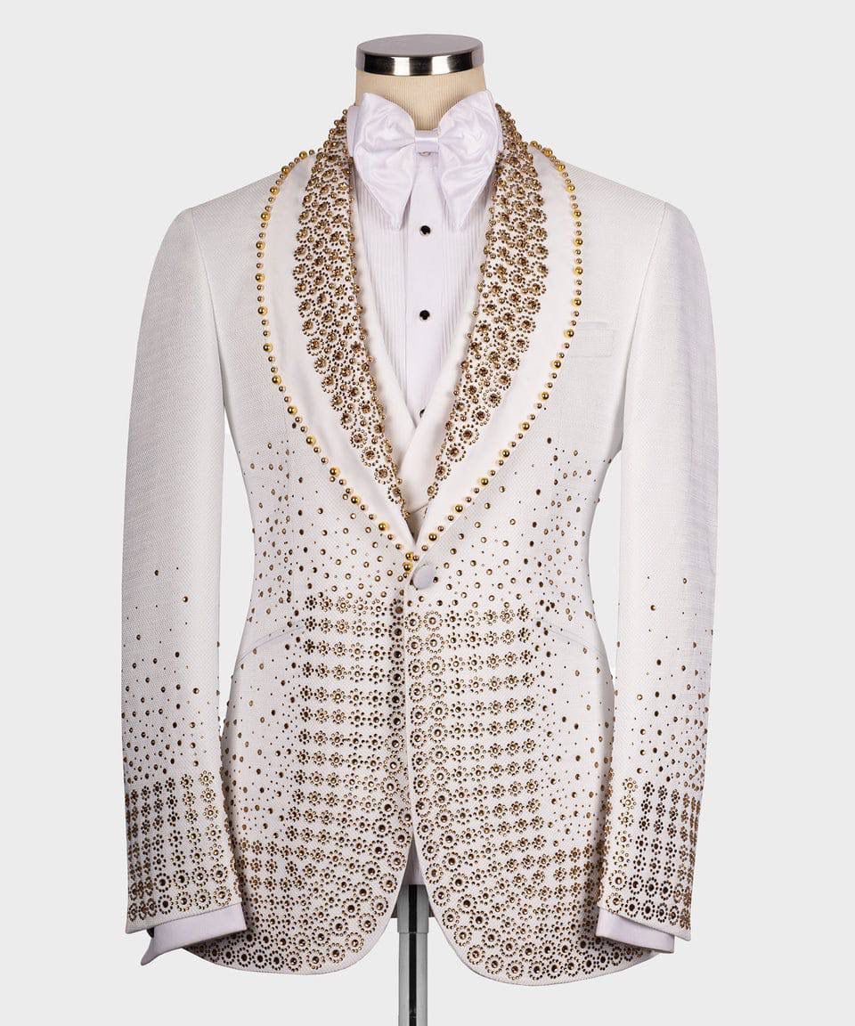 White tuxedo with intricate gold patterns on a mannequin against a white background