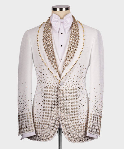 White tuxedo with intricate gold patterns on a mannequin against a white background